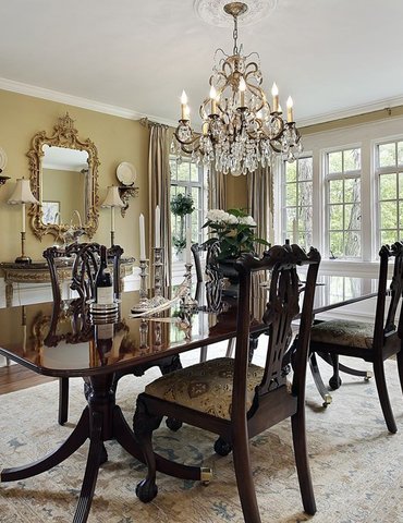 Wood table and chairs on rug