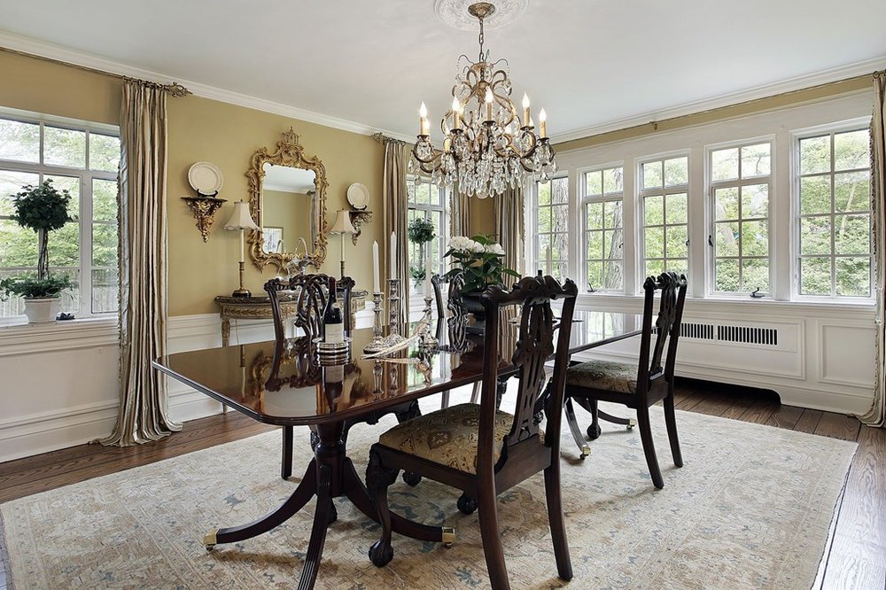 Wood table and chairs on rug